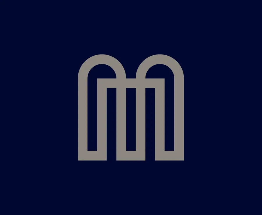 Custom logo design for Milini by Giancarlo Tosoni, inspired by single-stroke lettering and architectural curves.